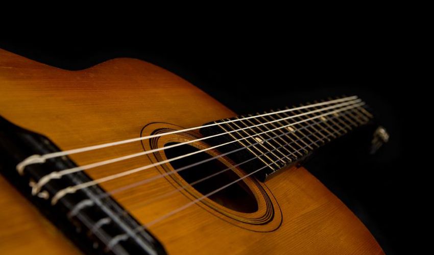 Connecting With People for Social Media Engagement - Guitar on Black Background